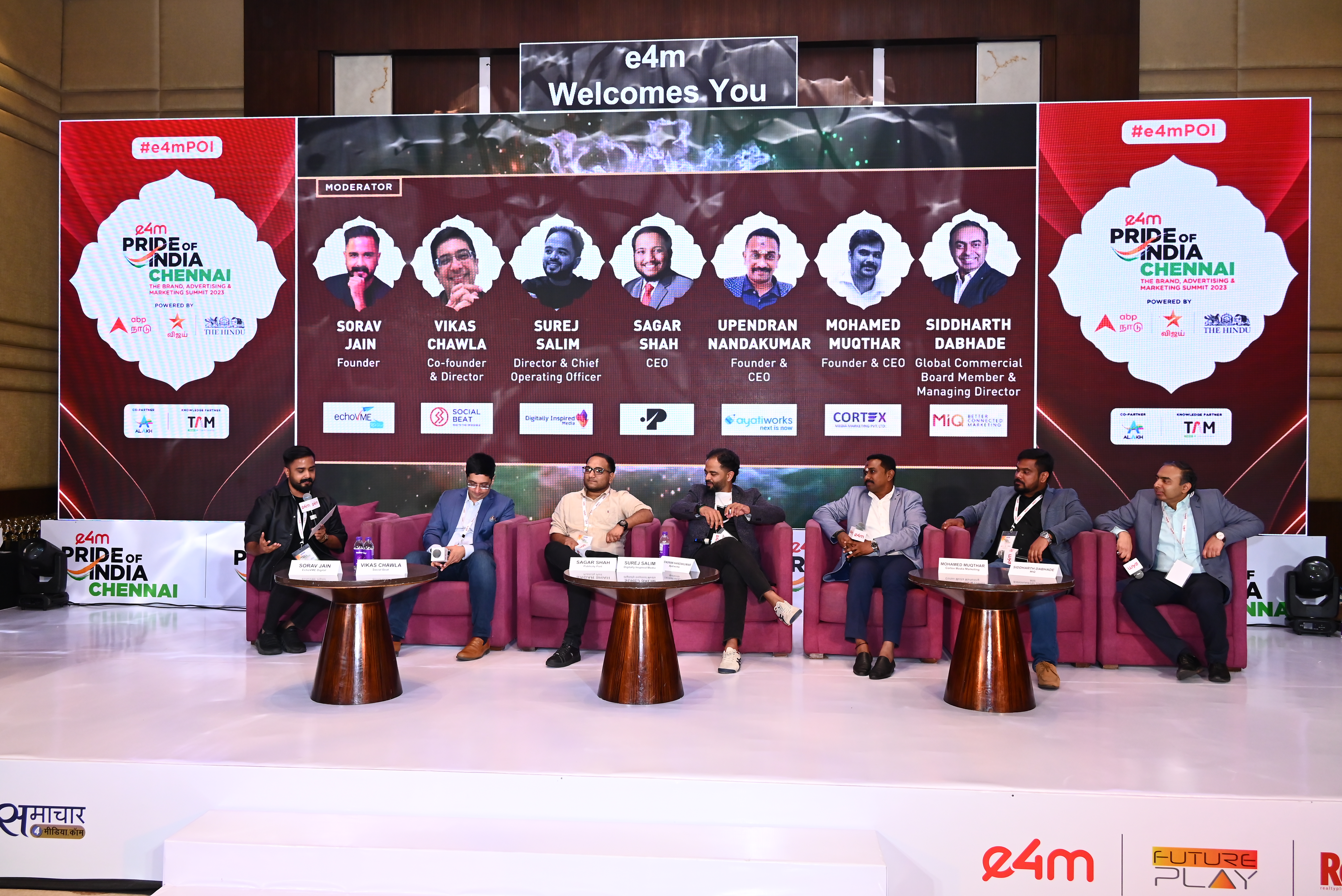 Sagar Shah on stage at e4m Pride of India — panel nameplate visible